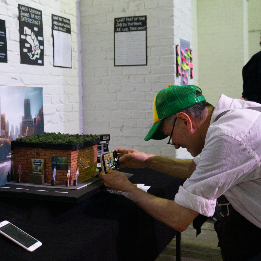 julia guerin analog minds visitor taking picture diorama